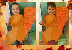 Dzieci pozują do fotoramki w kształcie wiewiórki.